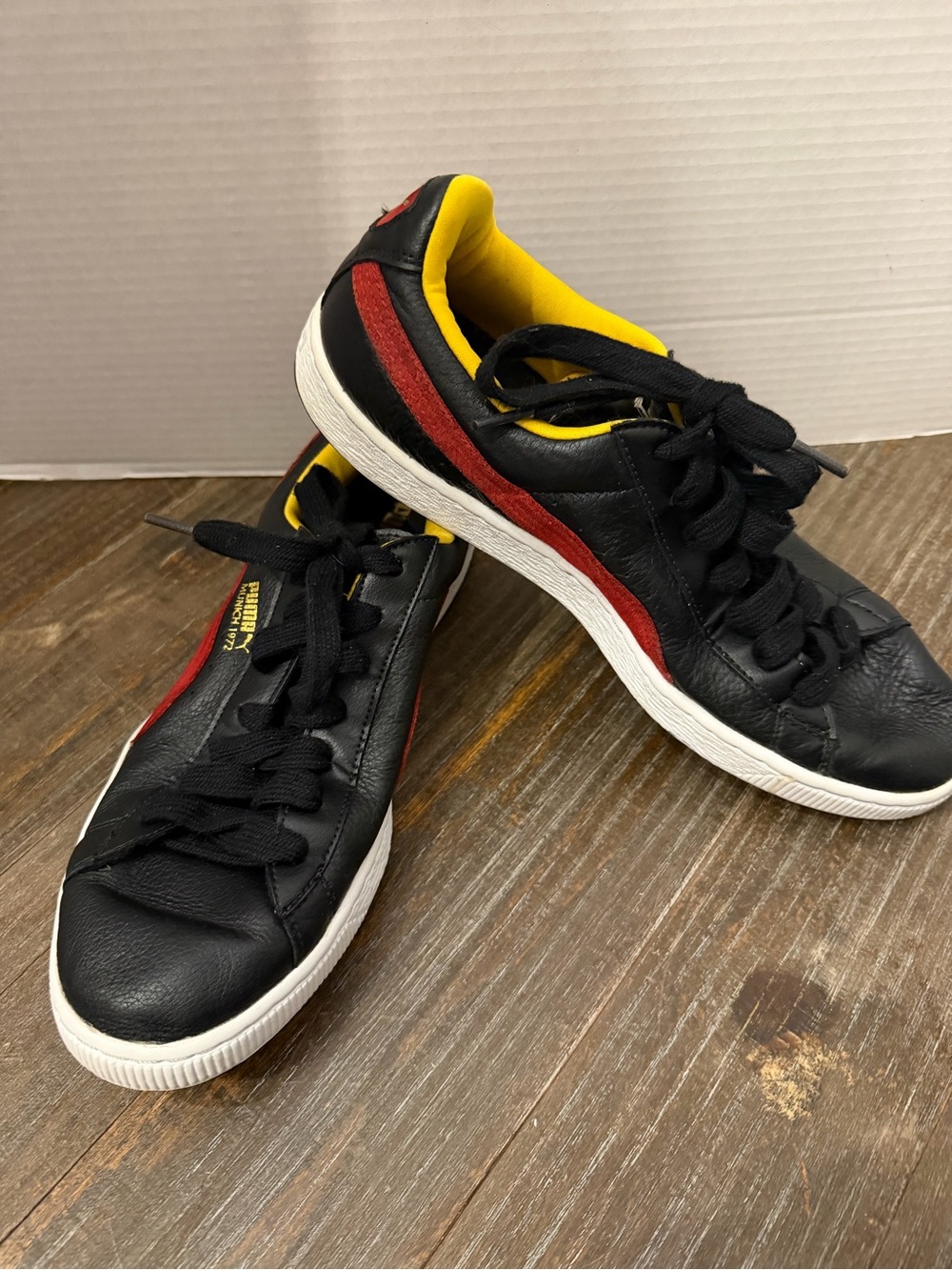 Puma Black Leather Sneakers with Red Side Stripe and Yellow Lining